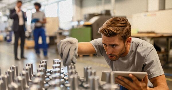 Manufacturing worker inspecting products