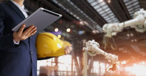 Industrial worker using computer software for tracking