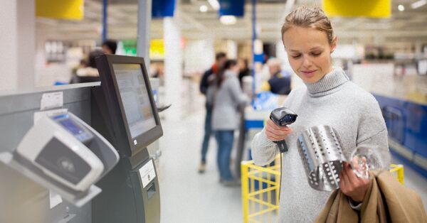 A customer using a self-checkout scanner
