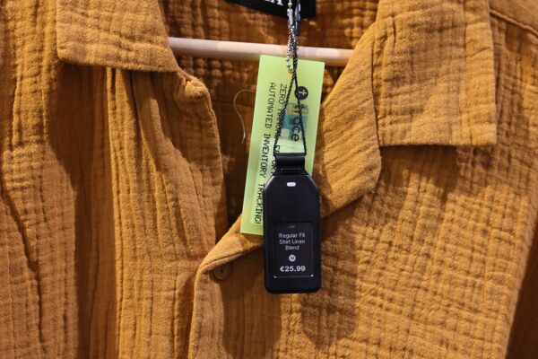 Newton X 1.3 as a price tag for clothing, attached to a string which includes a variation of the SOLUM Trace.