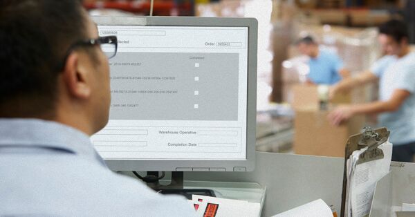 Person at Computer Terminal in Distribution