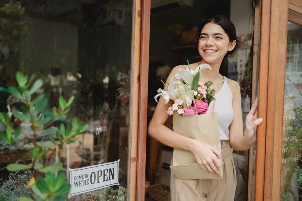 Happy smiling woman with flowers