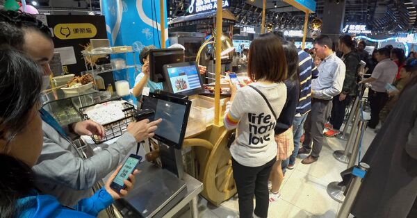 Customers using mobile payment and self-checkout machines