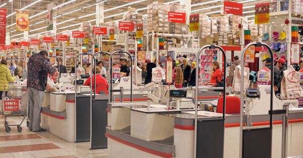 Customers queuing at checkout counters