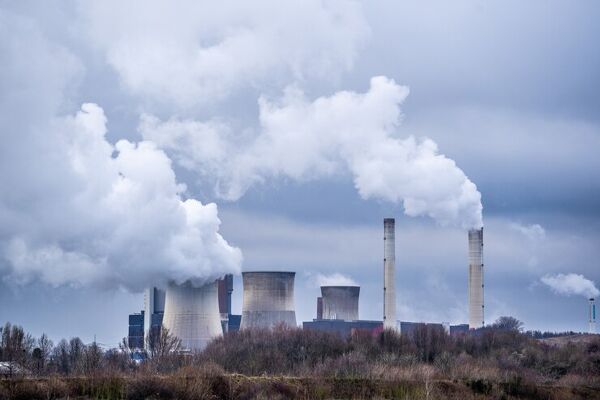 Wide angle shot white smoke coming out nuclear plants